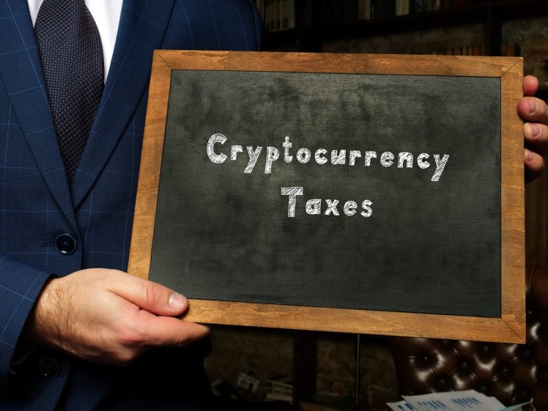 Cryptocurrency,Taxes,Inscription,On,Chalkboard.